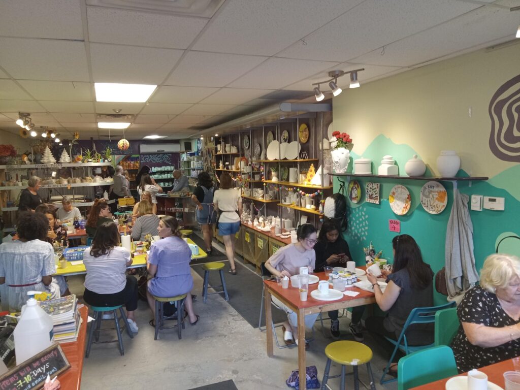 30 people gathered to paint mugs at the Mud Oven
